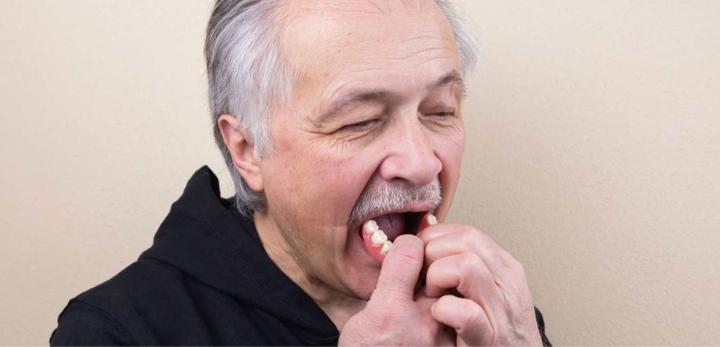 Removing dentures